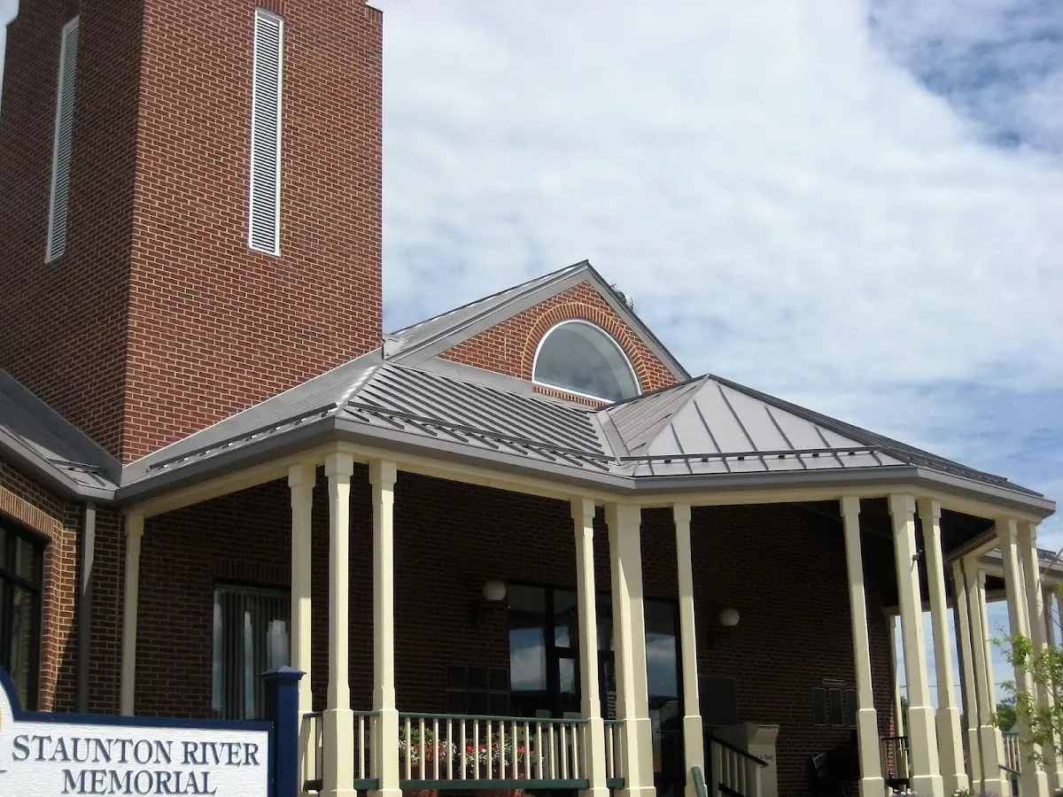 Skilled roofing craftsmen working on a residential roof in New Brighton